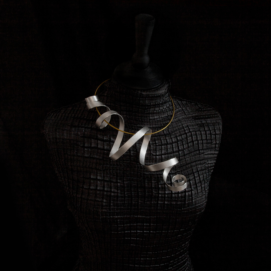 Calligraphy sculptural pendant & torque, reprocessed sterling silver with an 18kt Fairtrade Gold torque